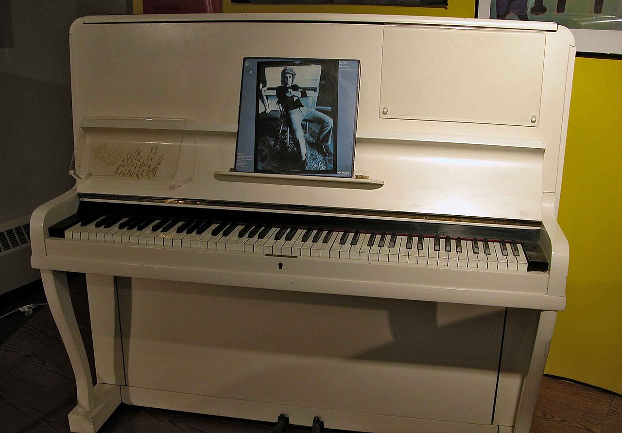 Elton John performing at the piano