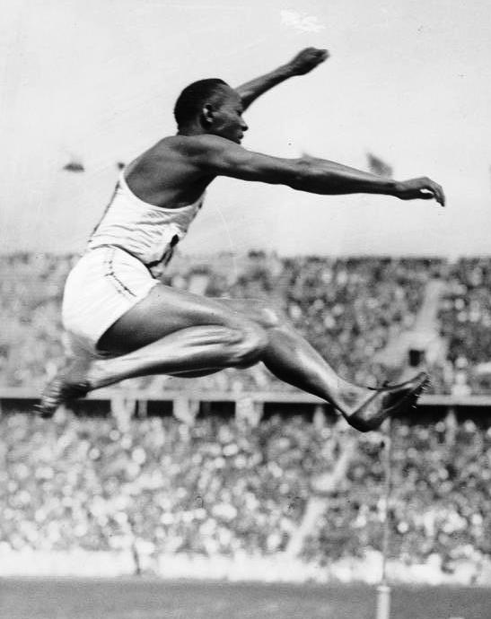 Jesse Owens competing in the long jump at the 1936 Berlin Olympics